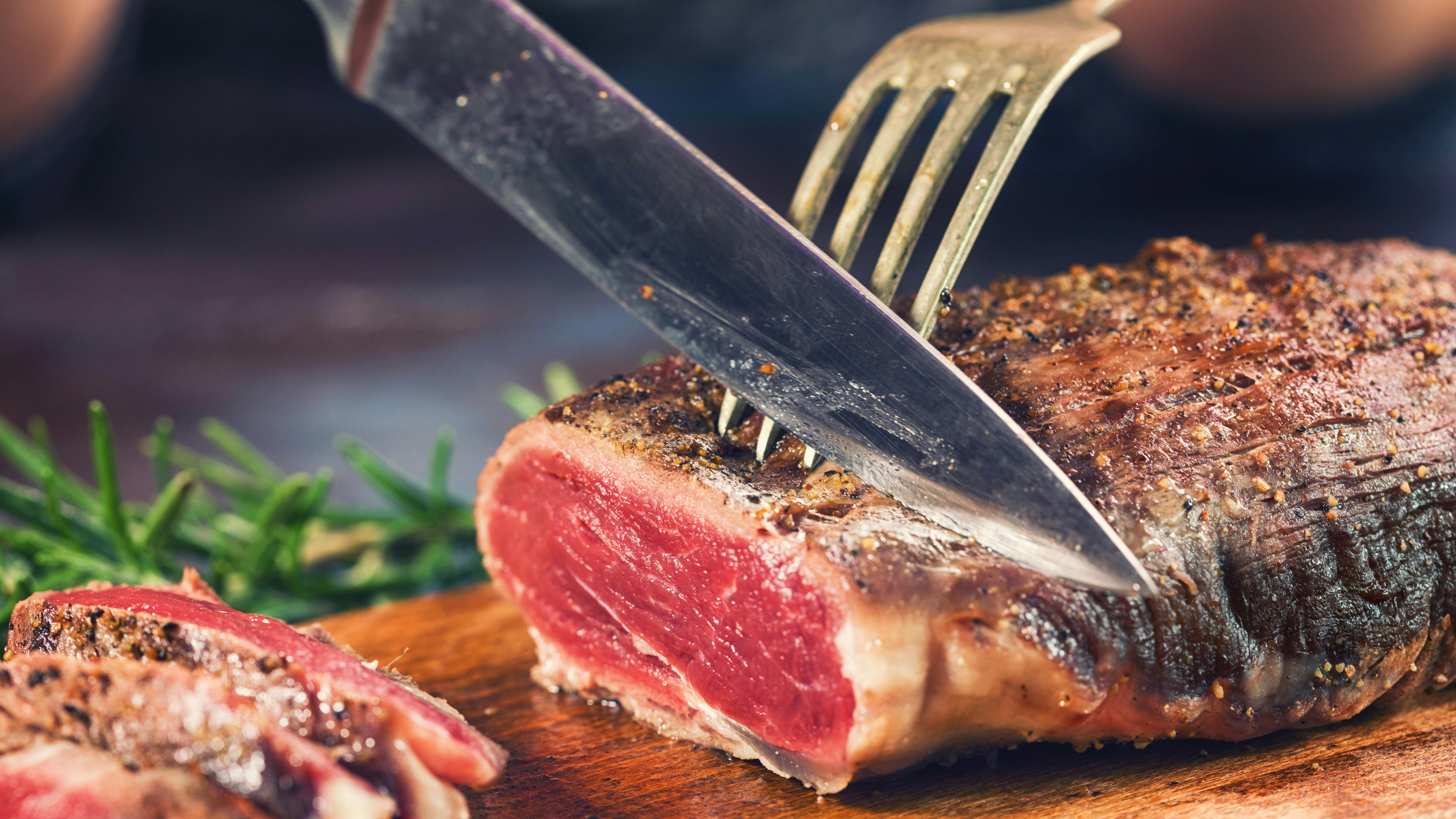 Cutting Juicy Beef Steak
