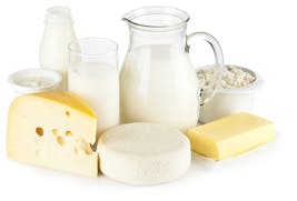 Assortment of most common dairy products on white backdrop