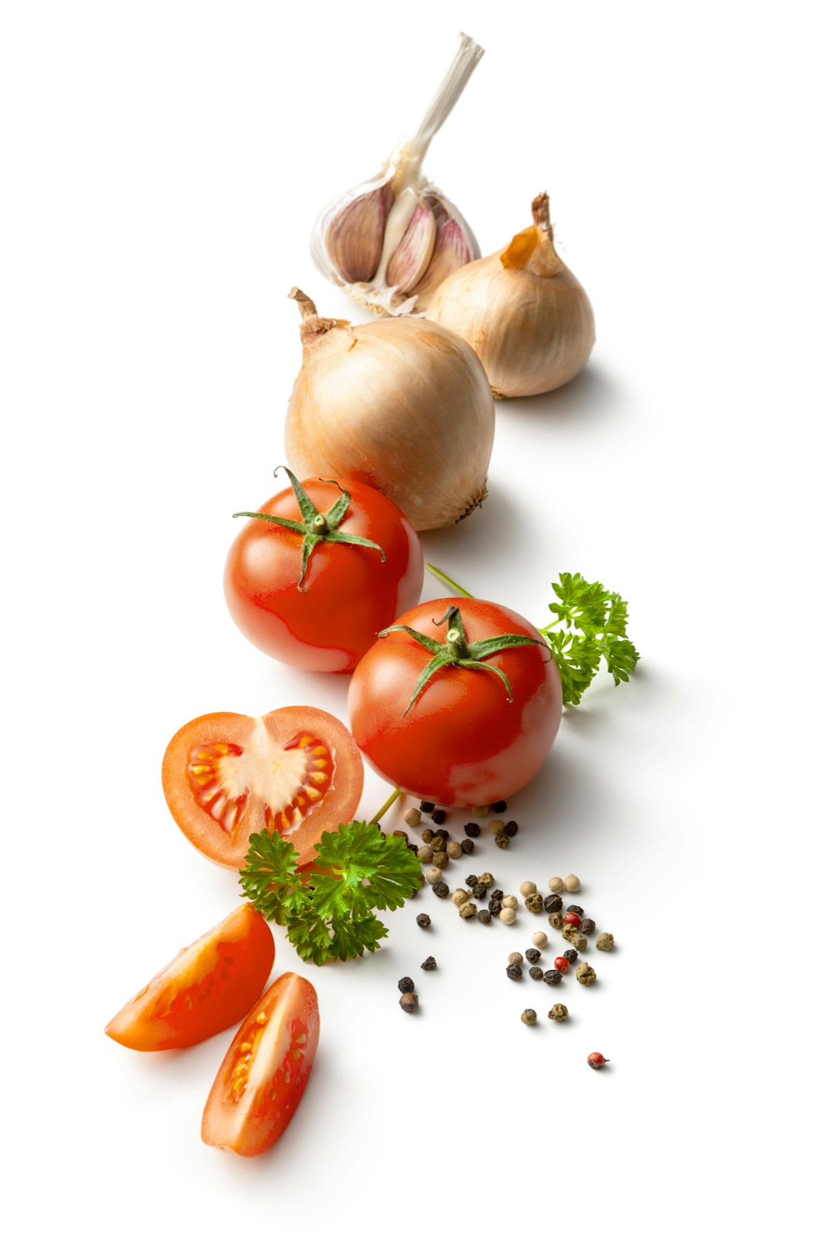 Seasoning: Tomato, Garlic, Onion, Parsley and Peppercorns Isolated on White Background