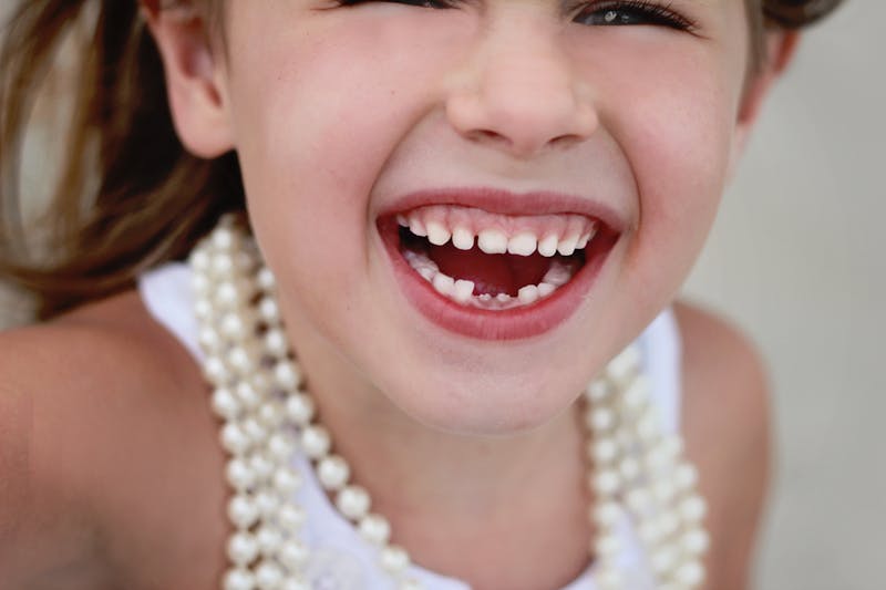 little girl loses her baby teeth