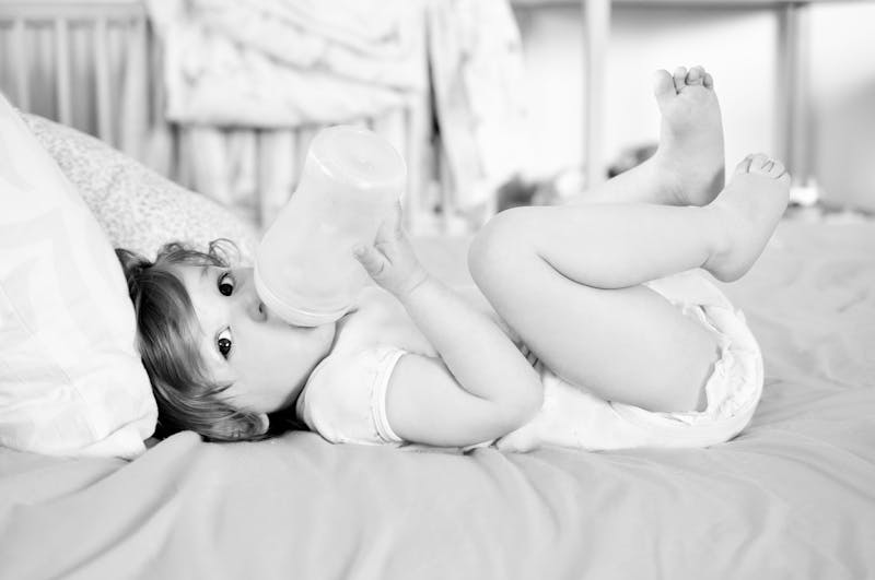 Baby Girl Drinking From Bottle