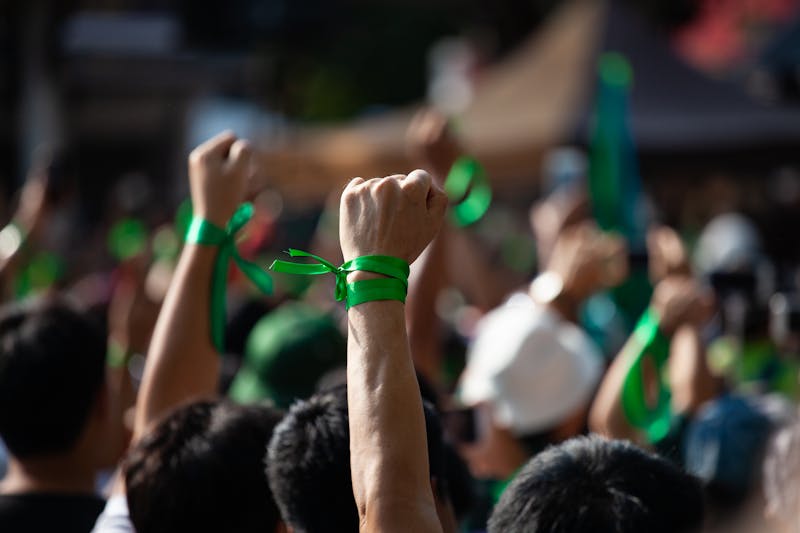 People raised hand air fighting for protest