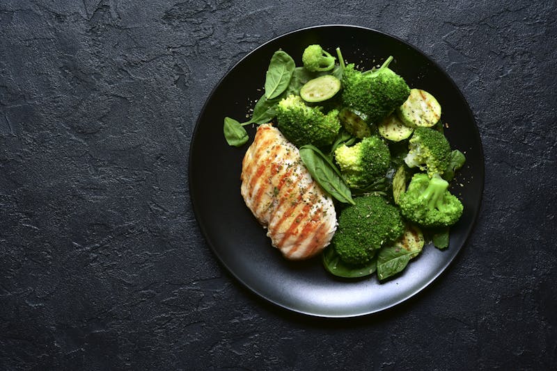 Grilled chicken fillet with green vegetable salad