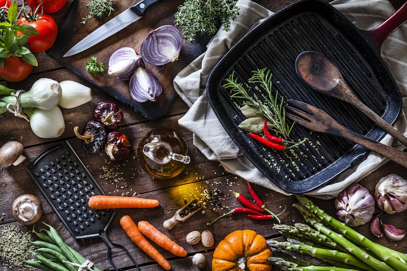 Fresh vegetables ready for cooking shot on rustic wooden table