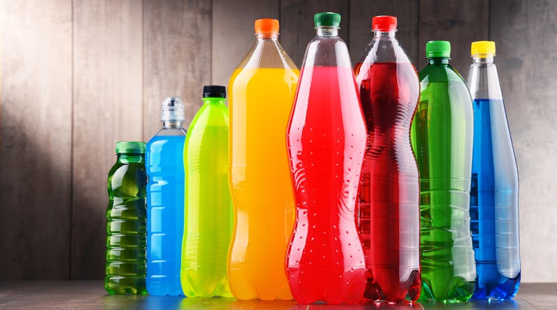 Plastic bottles of assorted carbonated soft drinks