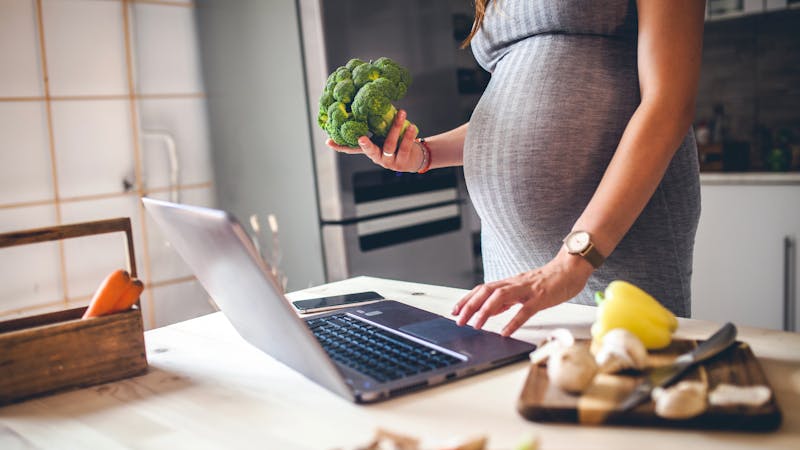 Pregnant woman ordering her favourite meal