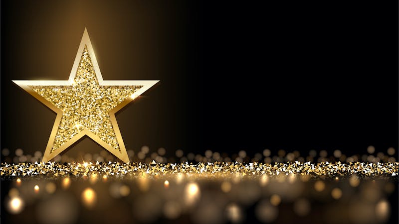 Golden sparkling star isolated on dark luxury horizontal background. Vector design element.