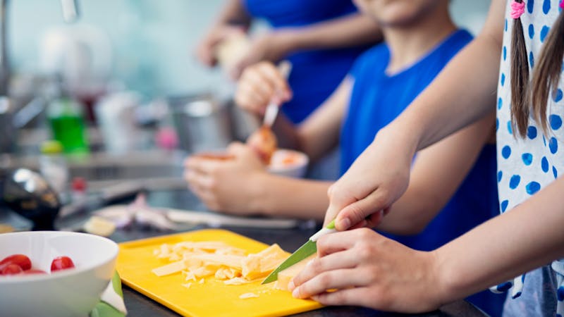 Mother and kids preparing lunch