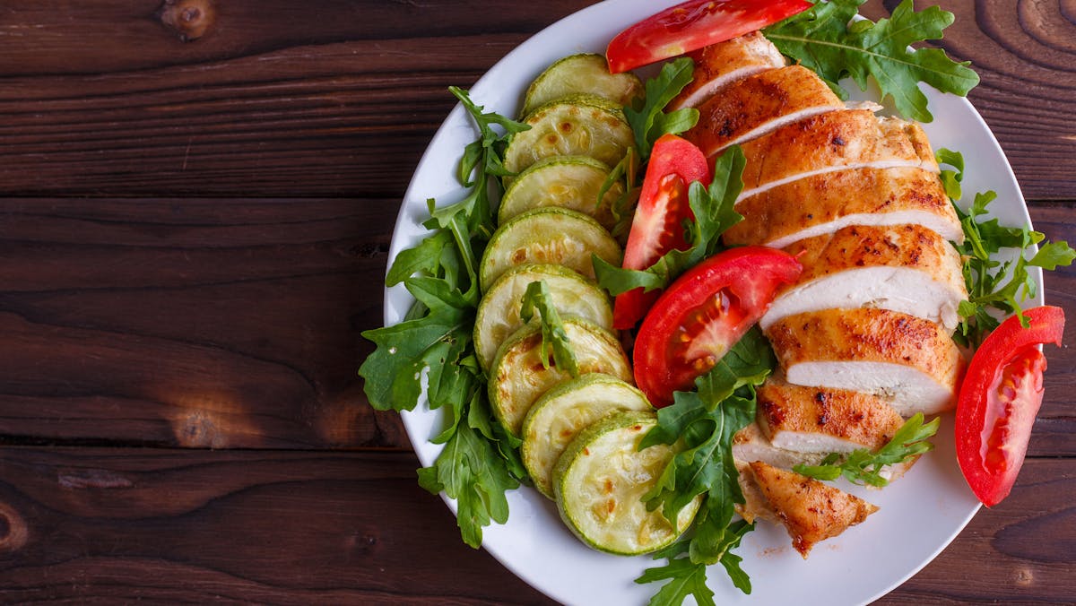 Healthy food, diet concept. Baked chicken breasts with zucchini