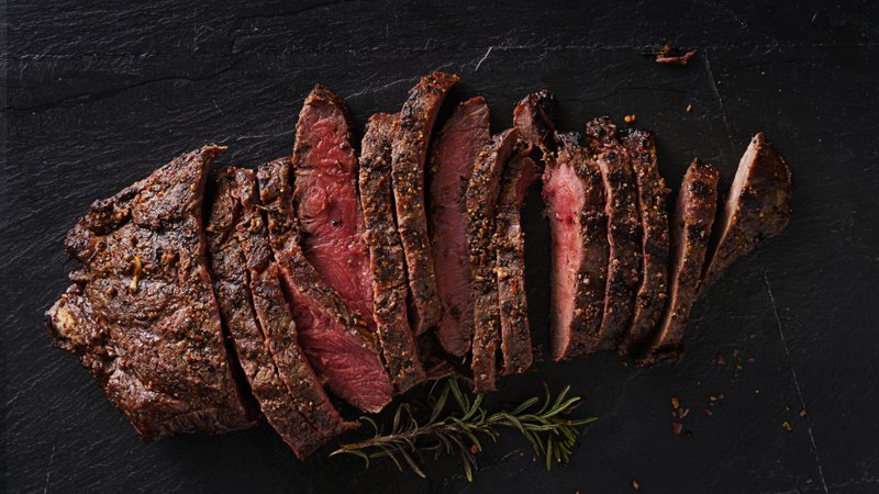 grilled flat iron steak shot in flat lay style