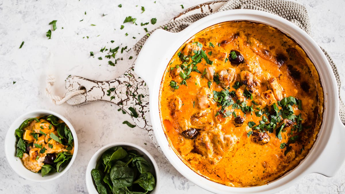 Keto pesto chicken casserole with feta cheese and olives