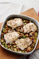 Butter-baked fish with Brussels sprouts and mushrooms