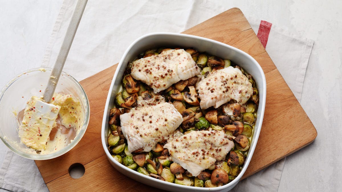 Butter-baked fish with Brussels sprouts and mushrooms