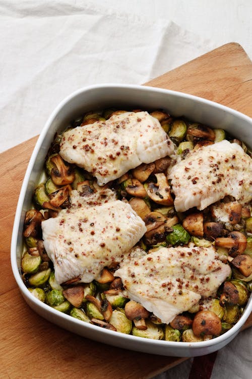 Butter-baked fish with Brussels sprouts and mushrooms