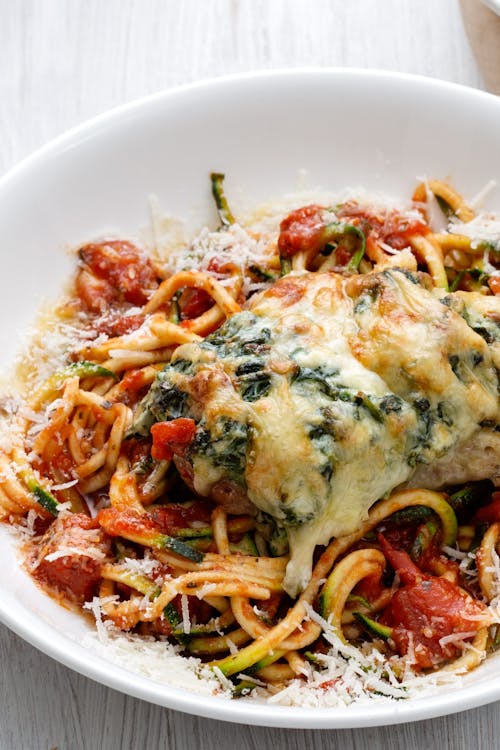 Stuffed chicken breast with zoodles and tomato sauce