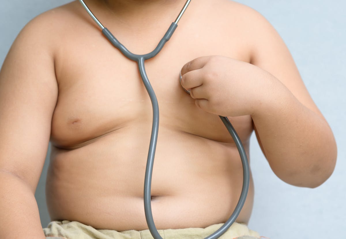 Obses boy check heart by stethoscope