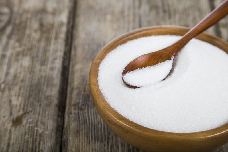 Sugar in a wooden bowl