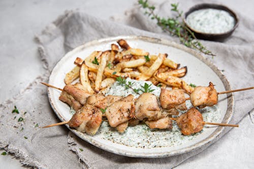 Chicken skewers with low carb fries and spinach dip
