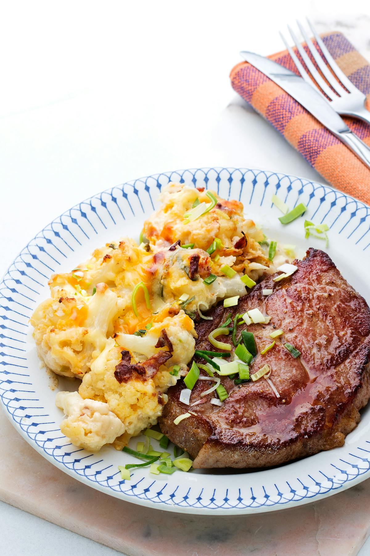 Pork shoulder chops with cauliflower au gratin