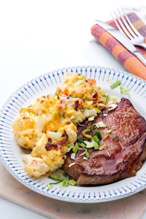 Pork shoulder chops with cauliflower au gratin