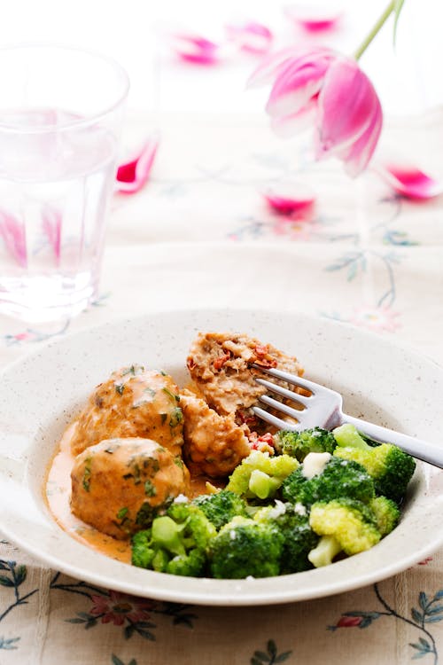 Italian chicken meatballs with cream sauce and broccoli