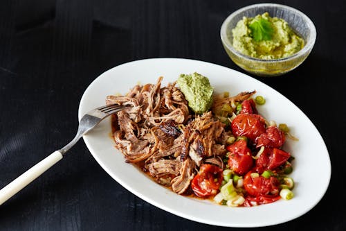 Keto pulled pork with roasted tomato salad