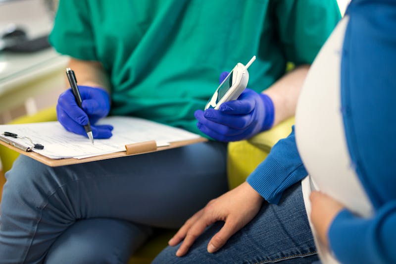 Pregnant Woman Having Blood Glucose Checked