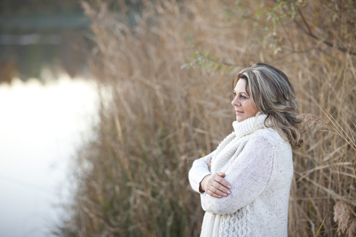 serious matured woman with crossed arms outdoor