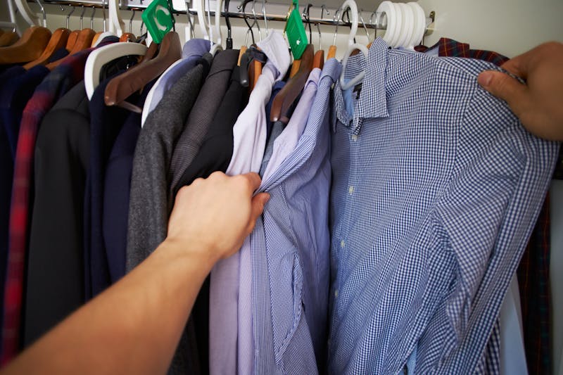 Point Of View Image Of Man Choosing Clothes From Wardrobe