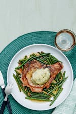 Pork chops with green beans and garlic butter