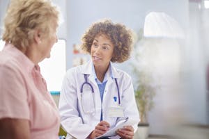 female doctor writing a prescription