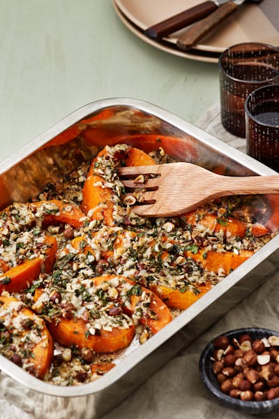 Roasted pumpkin with nuts and manchego cheese