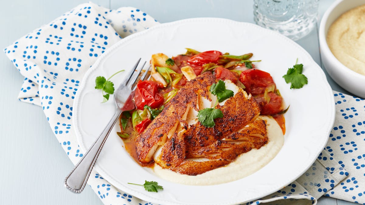 Spicy fish with butter-fried tomatoes and cashew sauce