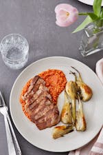 Pork shoulder with roasted fennel and Romesco sauce