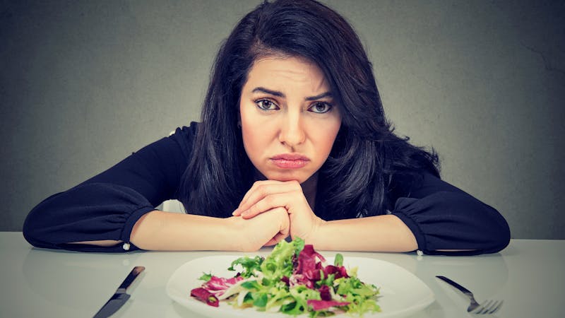 Dieting habits changes. Woman hates vegetarian diet