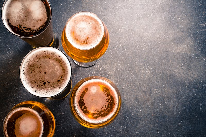 Beer glasses on dark table