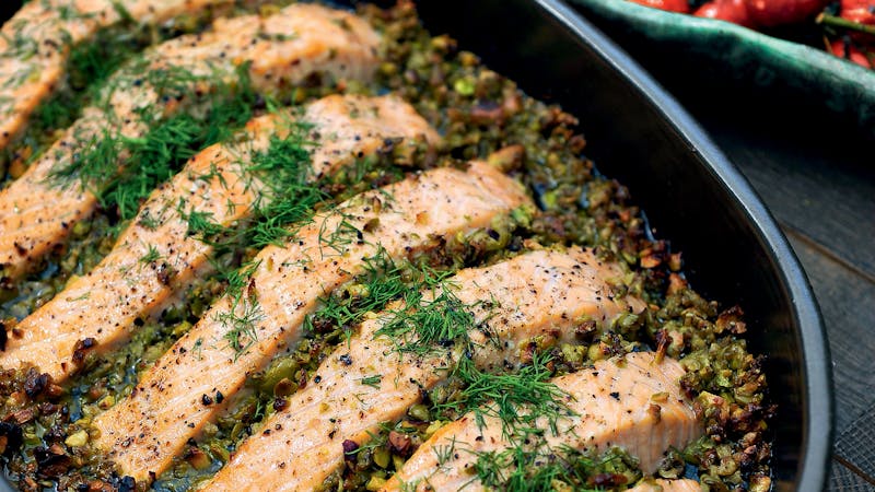 Salmon with olive-pistachio tapenade and tomatoes