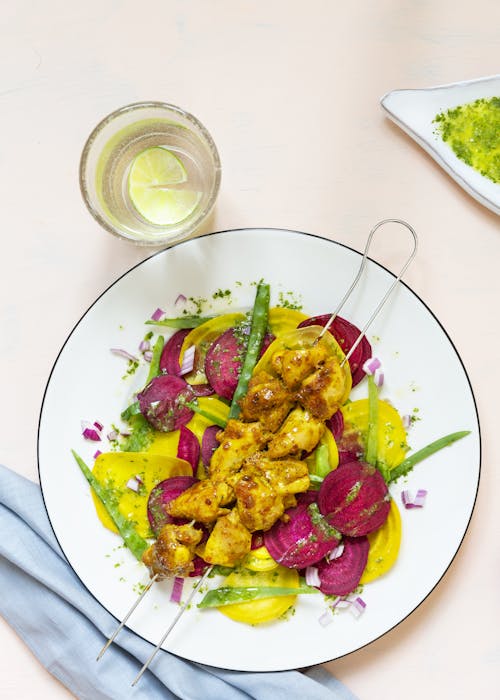 Yogurt chicken kebabs with beet carpaccio