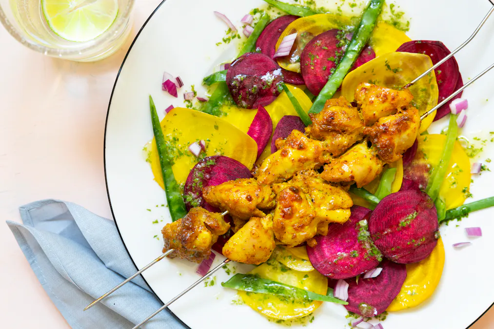 Yogurt chicken kebabs with beet carpaccio