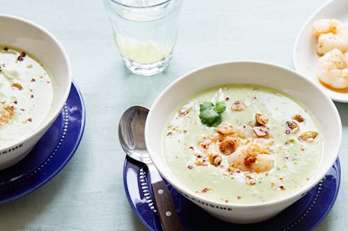 Avocado soup with shrimp and garlic chips