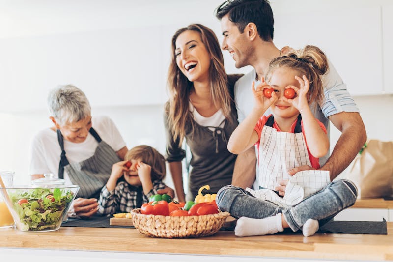 Multi-generation family having fun in the kitchen