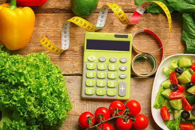 Calculator, measuring tape and set of healthy food on wooden table
