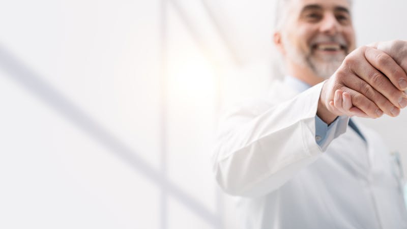 Doctor and patient shaking hands