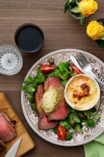 Beef sirloin with tarragon butter and creamy gratin