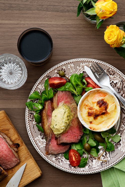 Beef sirloin with tarragon butter and creamy gratin