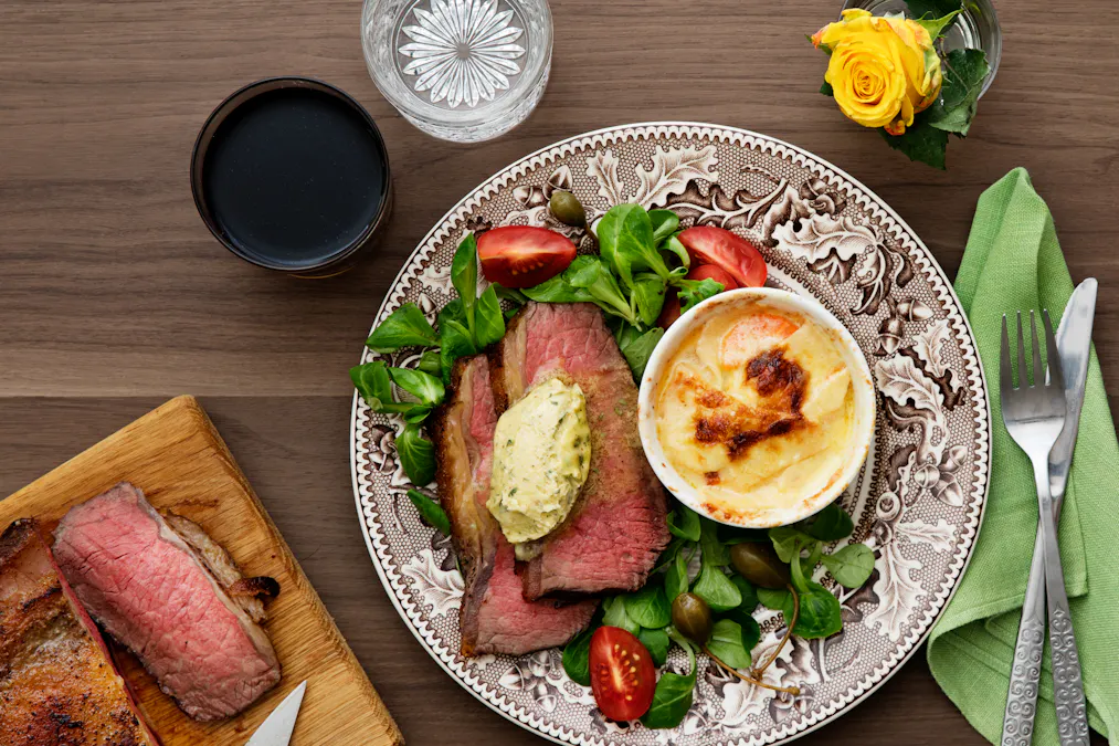 Beef sirloin with tarragon butter and creamy gratin