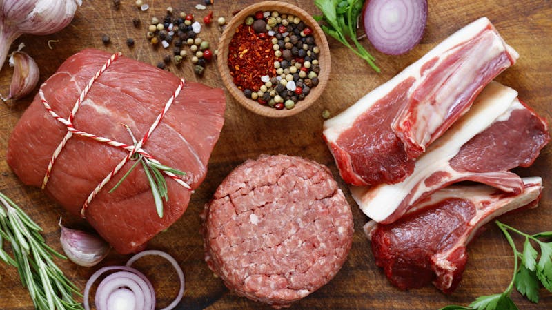 Organic raw meat on a wooden table