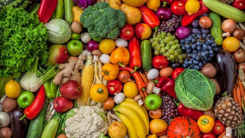 Vegetables and fruits large overhead mix group on colorful background