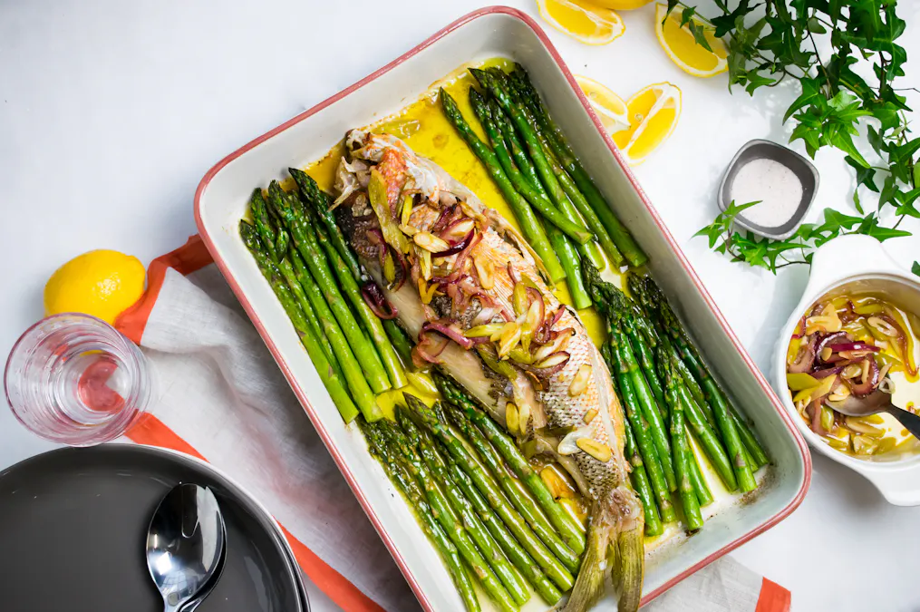 Baked snapper with onions and asparagus