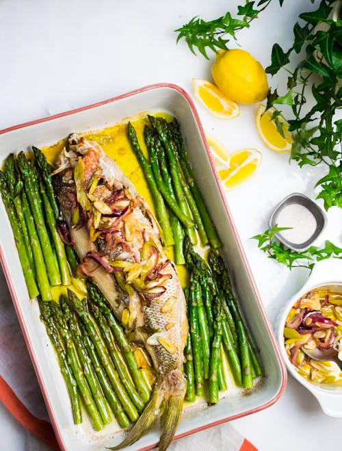 Baked snapper with onions and asparagus